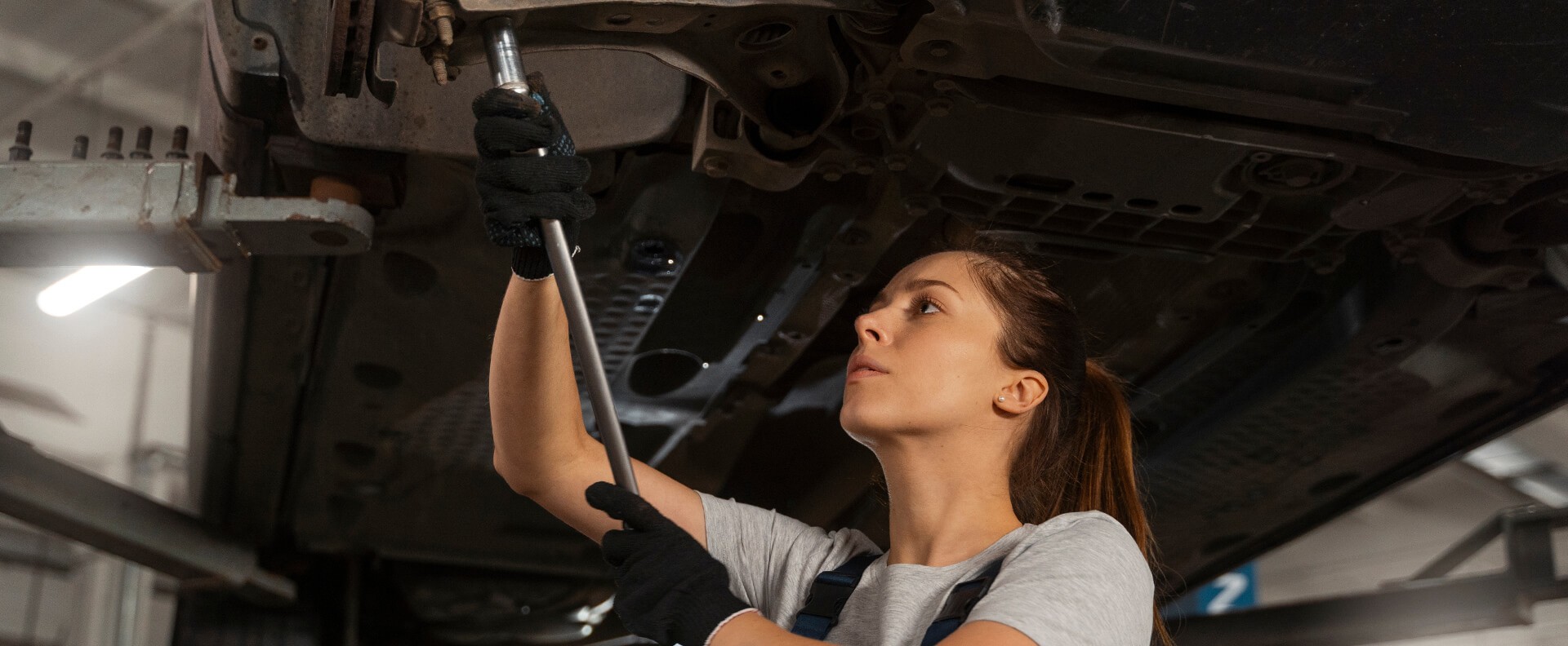 Technician working under a car